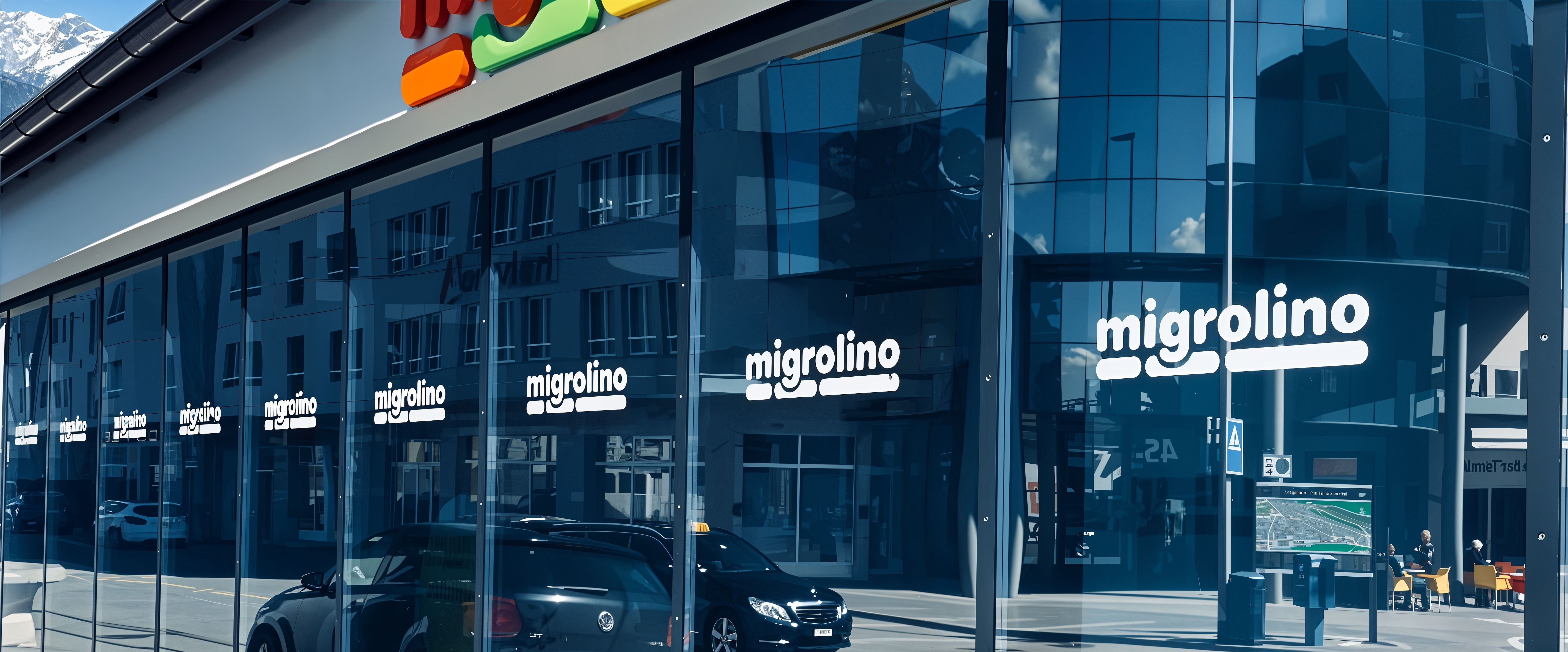 Façade Migrolino avec marquage vitrine HF Vitro — logo répété sur vitrages, pose professionnelle Suisse romande